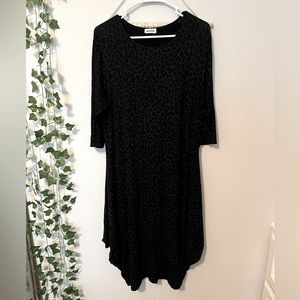 Worn once leopard asymmetrical dress 3/4 sleeve fits around S/M